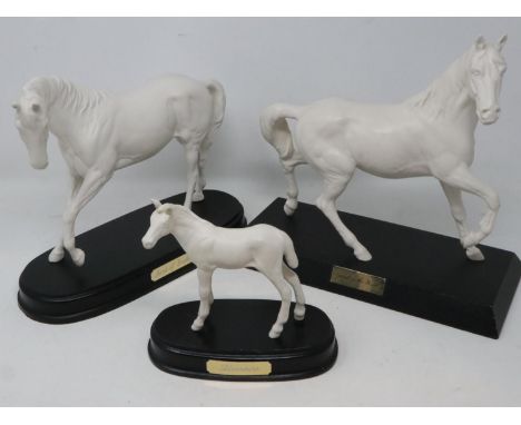 Three Royal Doulton white horses on plinths, Spirit of the Wind, Spirit of Youth, and Adventure, Adventure has had repair to 