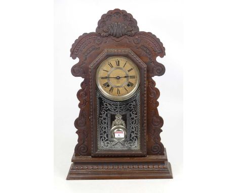An early 20th century American gingerbread type clock, the paper dial showing Roman numerals and signed "The Anonia Clock Co.