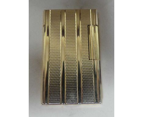 S.T. Dupont of Paris - a gilt metal pocket cigarette lighter, having all-over engine turned decoration, 58mm, in fitted box a