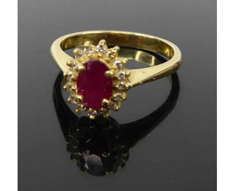 A contemporary 18ct gold ruby and diamond highlight set dress ring, 5.2g, size R