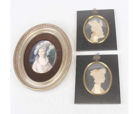 A pair of wax profile portrait busts by Leslie Ray of London, each housed in a glazed ebonised frame, full dimensions 15 x 12