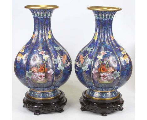 A pair of Chinese cloisonne enamel vases, each of ribbed lower baluster form, on varnished wooden base, height 45cmCondition 