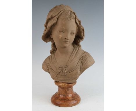 After Jean-Antoine Houdon (1741-1828), a terracotta head and shoulders portrait bust of a young girl, signed 'Houdon' to the 