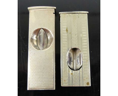 A modern engine turned white metal cigar cutter stamped 925, together with one other steel example (2) 