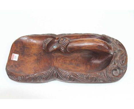 A Maori carved wood and mother of pearl inlaid canoe bailer, signed Tutu Honotapu verso, 42 x 23cm