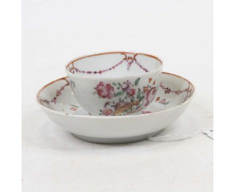 A late 18th century porcelain tea bowl and saucer, enamel decorated with a cornucopia of flowers, dia.12cm 