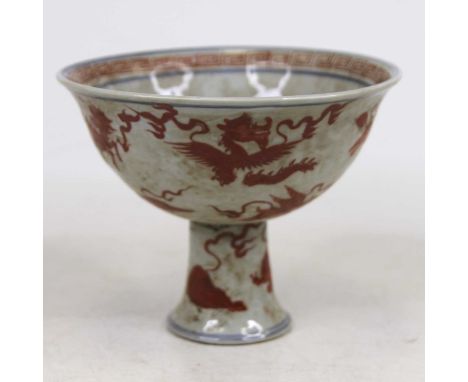 A Chinese porcelain stem cup, enamel decorated with mythical creatures, dia.16cm 