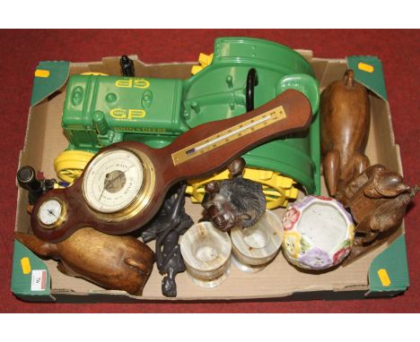 A collection of miscellaneous items to include carved hardwood model of a recumbent lion, novelty John Deere biscuit barrel i