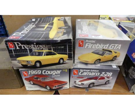 A collection of four boxed AMT/ERTL 1/25 scale plastic kits to include a Pontiac Firebird GTA