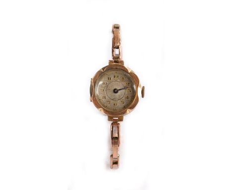 9 carat gold cased ladies wristwatch, the dial with Arabic numerals, manual wound, on a 9 carat gold sprung bracelet, the cas