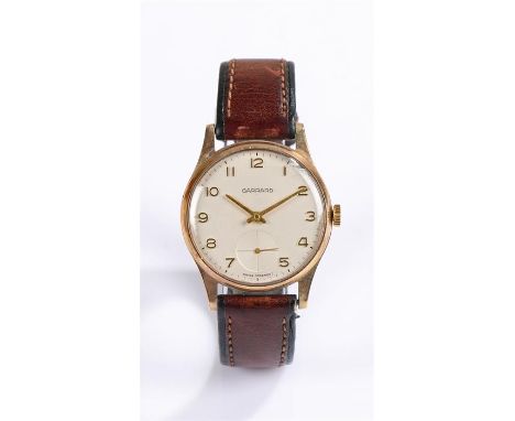 Garrard 9 carat gold cased gentleman's wristwatch, the white dial with gilt Arabic numerals, subsidiary seconds dial at the s
