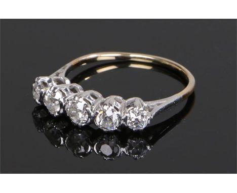 18 carat gold diamond set ring, with a row of five diamonds to the head, ring size P 1/2