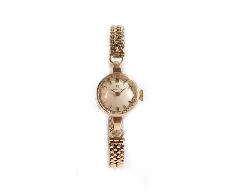 Omega 9 carat gold ladies wristwatch, the signed dial with baton numerals, manual wound the case 17mm, on a 9 carat bracelet 