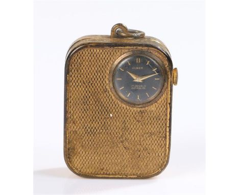 Huber gold coloured metal music box/watch fob, the signed black dial with baton numerals, engine turned case exterior, manual