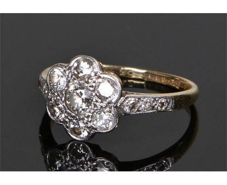 18 carat gold diamond set ring, in the form of a flower head, ring size L