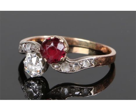 Diamond and garnet set ring, with a round cut diamond and garnet head, further diamonds to the shoulders, ring size R