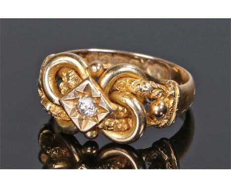 18 carat gold diamond set ring, with a central round cut diamond and cross over design shoulders, ring size L