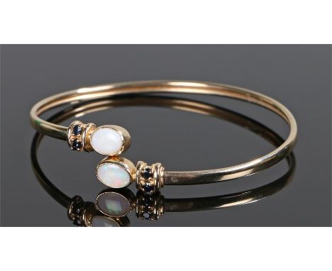 9 carat gold sapphire and opal bracelet, with two oval opals and four round cut sapphires, 8 grams