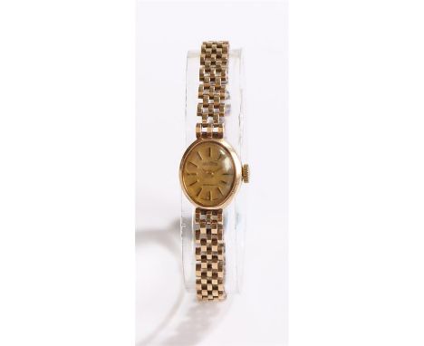 Gradus 9 carat gold ladies wristwatch, the signed dial with baton numerals, manual wound, on a 9 carat gold bracelet, the dia