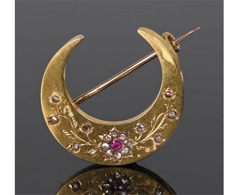 Gold ruby and diamond crescent brooch, with a flower set with a ruby and diamond surround with further diamonds trailing from