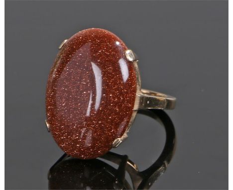 9 carat gold and goldstone set ring, with an oval goldstone with a four claw mount, ring size P