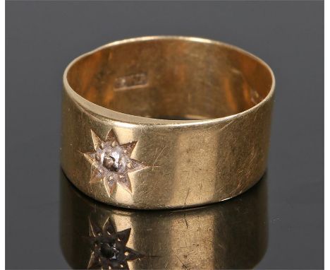 18 carat gold diamond set gentleman's ring, with a round cut diamond in star setting, ring size X, 7.9 grams