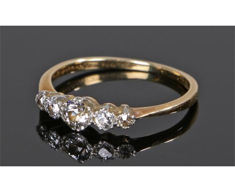 Diamond set ring, the row of five round cut diamonds with yellow metal shank, ring size N