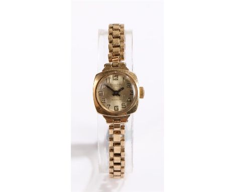 Excalibur 9 carat gold cased ladies wristwatch, the signed champagne dial with Arabic numerals, manual wound, on a rolled gol