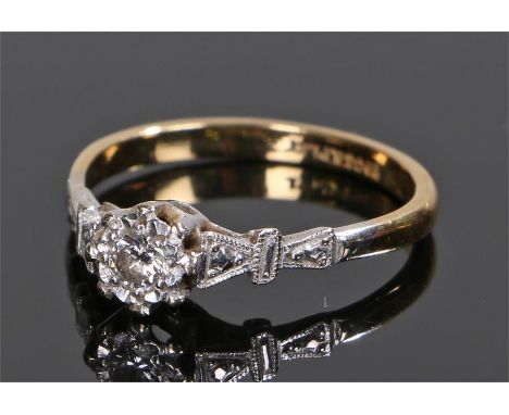 18 carat gold diamond set ring, the central round cut diamond with shaped shoulders, ring size O