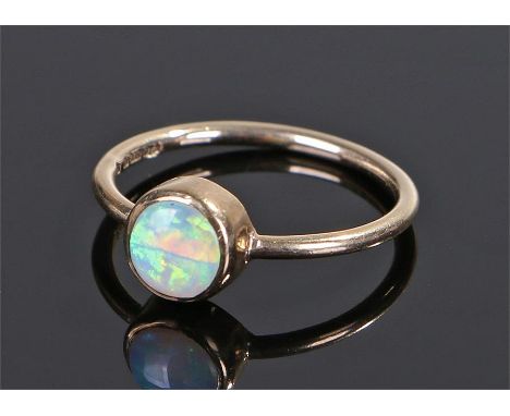 9 carat gold opal set ring, the circular opal to the head, ring size M