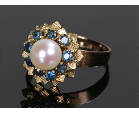 18 carat gold pearl and sapphire ring, with a central pearl with sapphire surround, ring size V