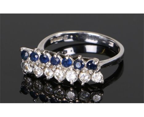 18 carat white gold diamond and sapphire ring, with a row of seven sapphires and seven diamonds, ring size Q