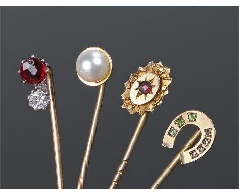 Stick pins, to include a diamond and garnet example, 9 carat gold horse shoe example, 9 carat pearl example and a 9 carat gol