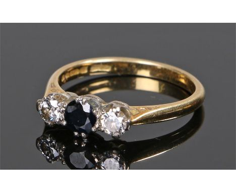 18 carat gold diamond and sapphire ring, the central sapphire flanked by a diamond to each shoulder, ring size O