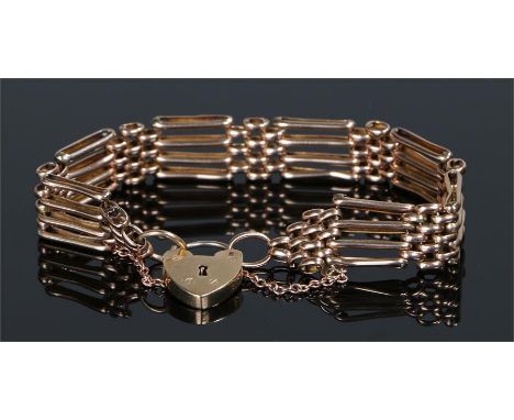 9 carat gold gate bracelet, with bar links and padlock clasp, 13.6 grams