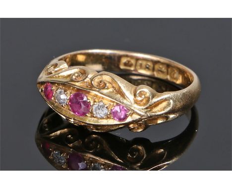 18 carat gold, diamond and ruby ring, the head set with three rubies and two diamonds, ring size I