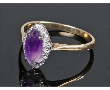 18 carat gold amethyst and diamond set ring, the naiveté cut amethyst with a diamond surround, ring size R