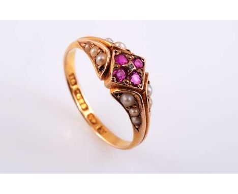 A RUBY AND SEED PEARL RING
c.1880-90
The four square cut rubies claw set in a square shaped mount, set to the centre with a s