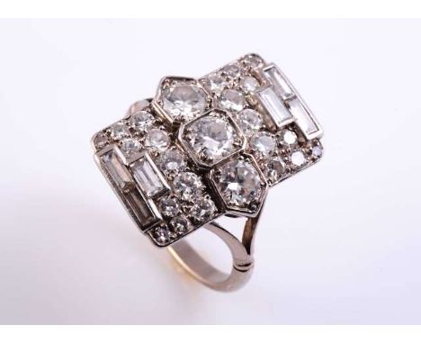 AN ART DECO DIAMOND RING
The rectangular shaped mount set to the centre with three brilliant cut four double claw set diamond