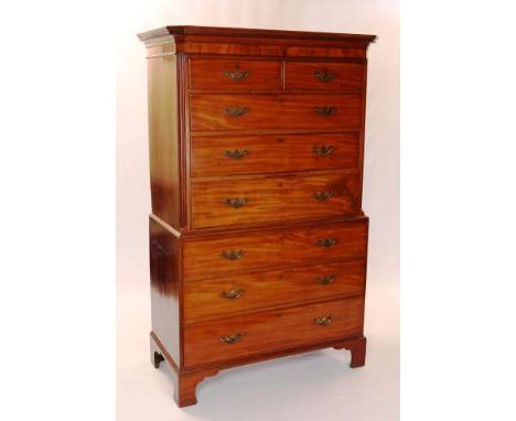 A GEORGE III MAHOGANY CHEST ON CHEST
The upper section with dentil cornice over two short above three long graduated drawers,
