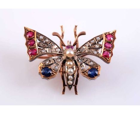 A PEARL, DIAMOND, SAPPHIRE AND RUBY BROOCH
c.1890
Modelled as a butterfly, the body set with five graduating claw and collet 