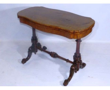A VICTORIAN BURR WALNUT FOLDOVER CARD TABLE
With swivelling top, raised on a trestle base.
72cm by 96cm (closed) by 50cm

