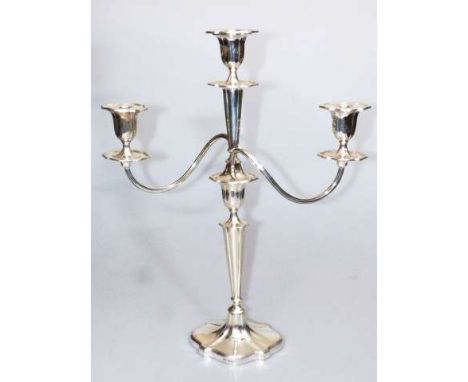 A GEORGE V SILVER CANDELABRUM
Walker & Hall, Sheffield 1919
The three-light superstructure with detachable shaped-oval drip p