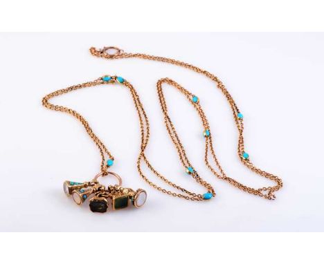 A TURQUOISE SET CHAIN AND FOB CHARMS
c.1900
The five fob charms with agate seals, two with engraving, all with applied and en