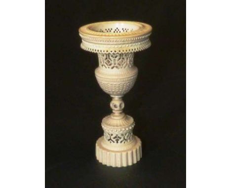 A CHINESE CANTONESE CARVED IVORY MODEL OF AN URN
19th Century
Of pedestal form with fret carving.
13cm