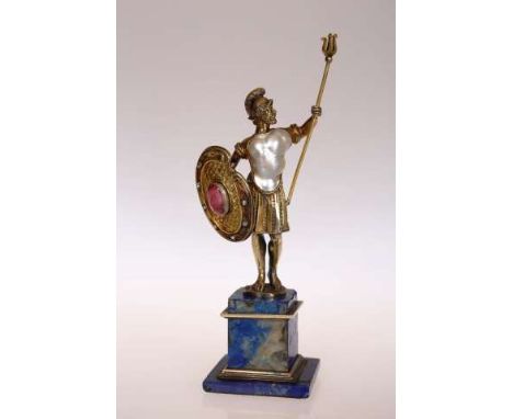 A FINE 19TH CENTURY JEWELLED FIGURE OF A ROMAN WARRIOR
With pearl inset forming his torso, holding a trident in his raised ar