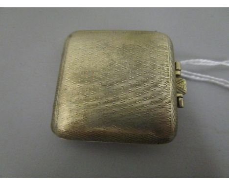 A small silver cased, folding travelling clock with cream coloured dial, luminous Arabic numerals and hands, off set subsidia