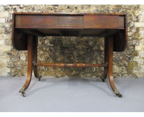 A Regency brass inlaid, rosewood sofa table with twin fall flaps over a pair of frieze drawer, raised on square, tapered, spl