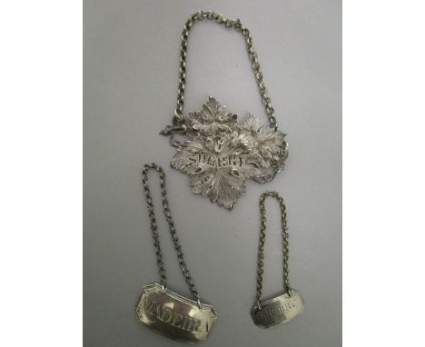 Three Georgian silver decanter labels, one in the form of grape leaves, namely for Sherry, London 1827, marks for Mary Ann an