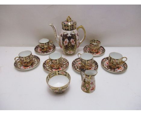 A matched Royal Crown Derby china Imari pattern coffee set, comprising a coffee pot, 7 1/2 h, a cream jug, 3 1/4 dia, six can